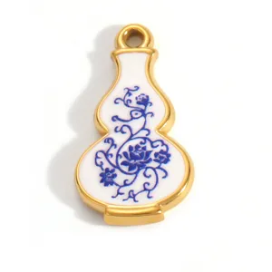 Detailed macro view of gold-plated stainless steel gourd pendant with blue floral enamel