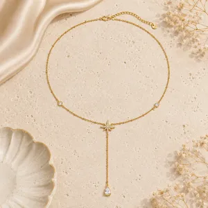 Close-up of gold-plated titanium steel Y-necklace with an eight-pointed star and zircon drop
