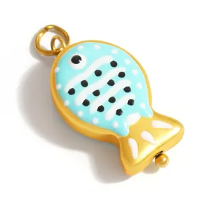 Close-up of a blue and gold fish-shaped glass charm with white stripes for DIY jewelry
