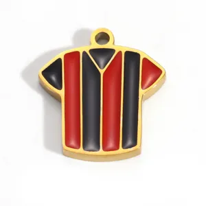 Detail of a gold-plated stainless steel jersey pendant with red and black stripes.