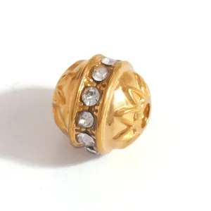 Close-up of gold-plated stainless steel spacer bead with inlaid sparkling crystals
