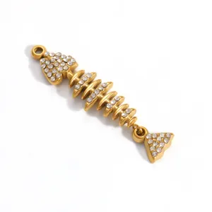 Detail view of a gold-plated stainless steel fishbone pendant with sparkling rhinestones