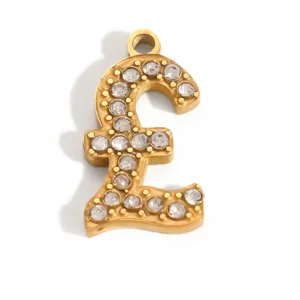 Detailed close-up of a gold-plated stainless steel British pound symbol pendant with crystals