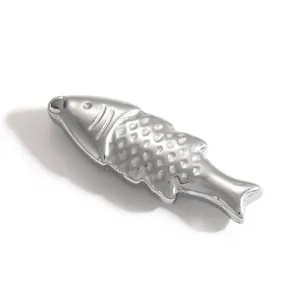 Macro detail of a polished silver stainless steel fish charm showing intricate scale patterns