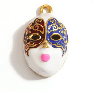 Detailed macro view of a colorful enamel opera mask pendant with premium gold plating