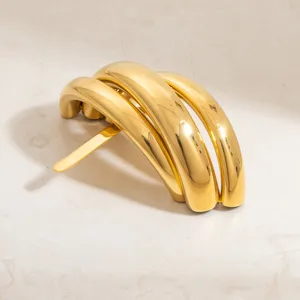Close-up detail of vintage C-shaped gold plated stainless steel hair accessory