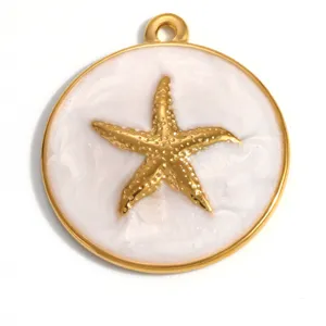 Macro detail of a golden starfish pendant featuring textured white enamel background.
