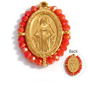Detailed view of 18k gold-plated religious Virgin Mary pendant with red faceted beads