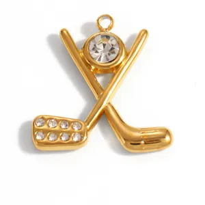 Detailed macro shot of a gold-plated golf club pendant with sparkling rhinestones