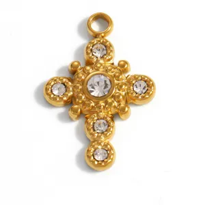 Macro view of gold-plated stainless steel cross pendant featuring clear rhinestone inlay