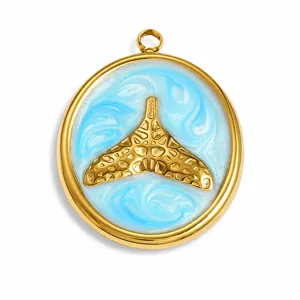 Detail view of a golden whale tail pendant featuring a blue swirl ocean enamel design.