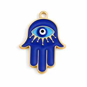 Detailed view of a gold-plated Hamsa Hand charm with blue enamel Evil Eye design