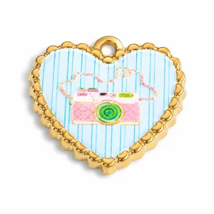 Close-up of a heart-shaped stainless steel pendant with a colorful camera design
