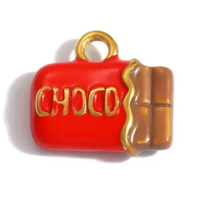 Close-up detail of a red and brown enamel chocolate bar charm with gold 'CHOCO' lettering