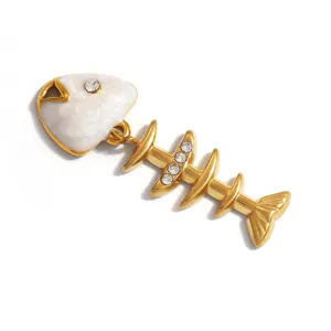 Close-up of a gold-plated stainless steel fishbone pendant with white floral relief