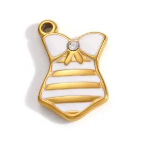 Close-up of a gold-plated stainless steel corset pendant with white enamel and rhinestone