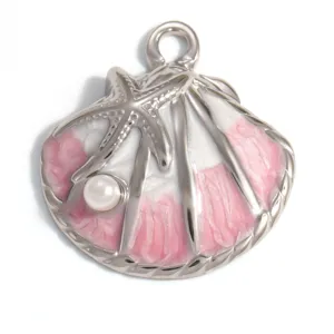 Detailed macro view of an ocean-themed seashell pendant with pink enamel and a pearl.