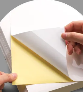 A4 self-adhesive sticker paper detail showing white glossy printable surface and yellow backing.