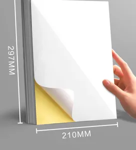 Close up detail of A4 blank self adhesive sticker paper with yellow backing liner sheet.