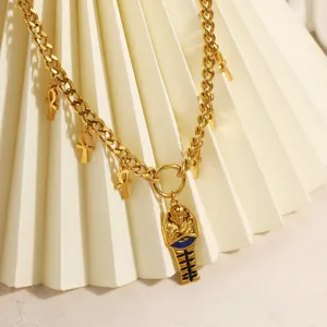 Detailed view of gold stainless steel necklace with Egyptian Pharaoh and Ankh charms