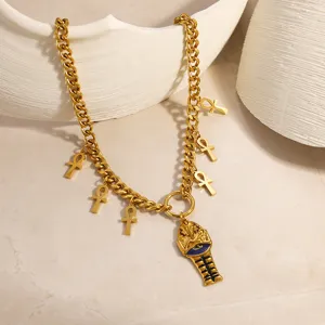 Close-up of gold-plated stainless steel necklace with Egyptian Pharaoh and Ankh pendants