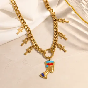 Close-up detail of 18k gold plated Egyptian Queen Nefertiti pendant and Ankh charms