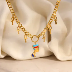 Detailed view of Nefertiti bust pendant and Ankh charms on 18k gold plated chain