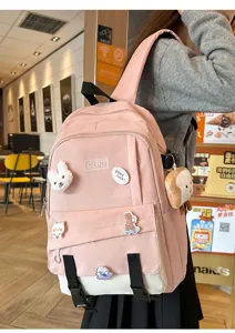 Sac à dos scolaire rose et beige grande capacité avec charms mignons.