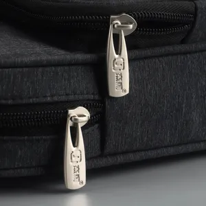 Black waterproof business briefcase detail main image featuring durable fabric and metal zipper pullers.