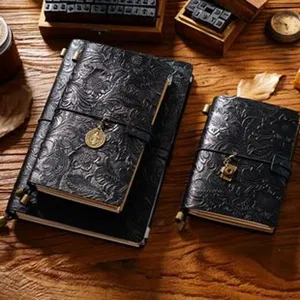 Vintage embossed leather journal notebook with metal charm and elastic band for writing