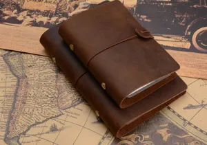 Handmade vintage leather travelers notebook retro diary journal with strap and brass rivets for office.