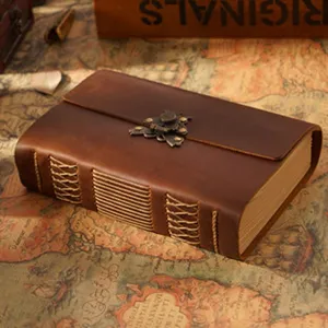 Handmade retro genuine leather notebook with metal clasp and vintage stitched binding for daily.