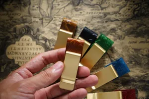 Vintage brass pen clip and metal money clip with embossed leather for traveler notebook diary.