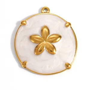 Close-up of a gold-plated flower pendant with white enamel detail for DIY jewelry