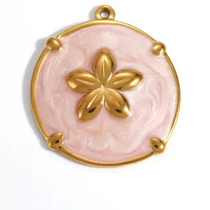Close-up of gold-plated flower pendant with pink pearlescent enamel for DIY jewelry
