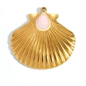 Detailed view of a gold-plated stainless steel scallop shell pendant with pink enamel