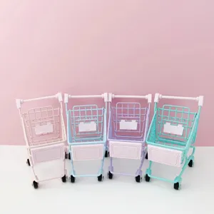 Close-up detail of mini metal shopping cart ornament in pastel colors with rolling wheels.