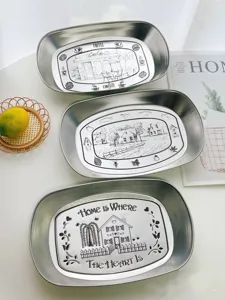 Retro stainless steel food tray set with vintage coffee and home print designs for table.