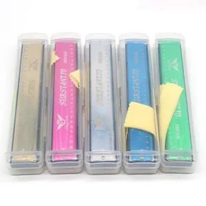 Metal 24-hole double-row tremolo harmonica with transparent storage case and cleaning cloth.