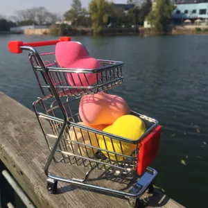 Mini shopping cart makeup sponge holder set, cute desktop storage display prop for beauty.