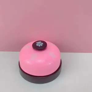 Pink pet training bell with cute paw prints, metal service call bell for cats and games.