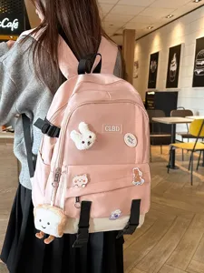 Grand sac à dos scolaire rose et blanc élégant avec des accessoires en peluche