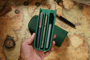 Handcrafted crazy horse leather 3-slot pen case, vintage magnetic drawer design for students.