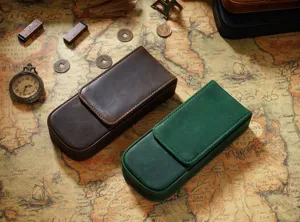 Handmade crazy horse leather pen case holding three pens with magnetic closure design for students and office.