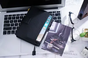 Schwarze A6 Terminplaner Hülle aus echtem Rindsleder mit Litchi Muster für Notizbuch.