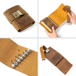 Handmade leather vintage journal notebook with metal lock and binder rings, detail view.