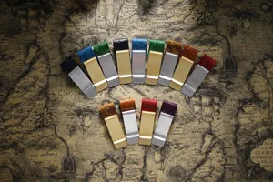 Detail view of colorful embossed leather metal money clips and pen clips in assorted finishes.