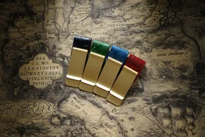 Detailed close-up of vintage brass money clips with embossed leather in assorted colors.
