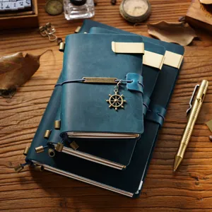 Vintage genuine leather traveler notebook set with brass metal charms, pocket diary.