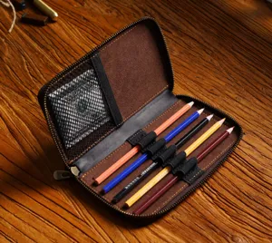 Vintage genuine leather zipper pencil case and organizer pouch with colored pencils.